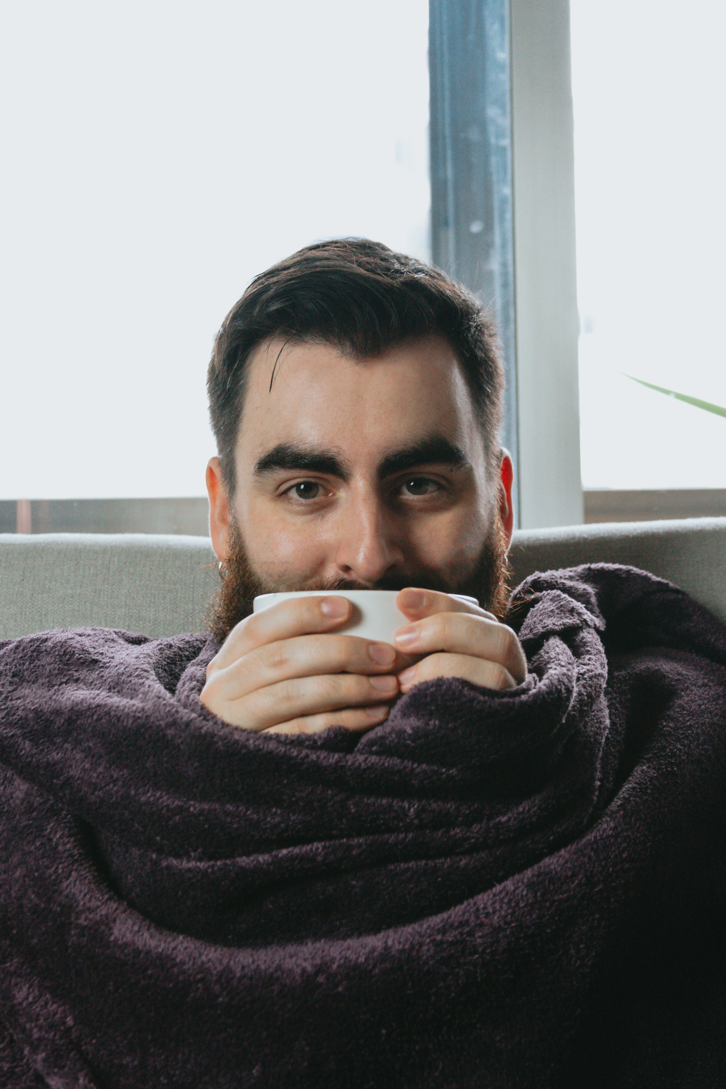 files/man-wrapped-in-blanket-and-holding-bowl-close-to-his-face.jpg